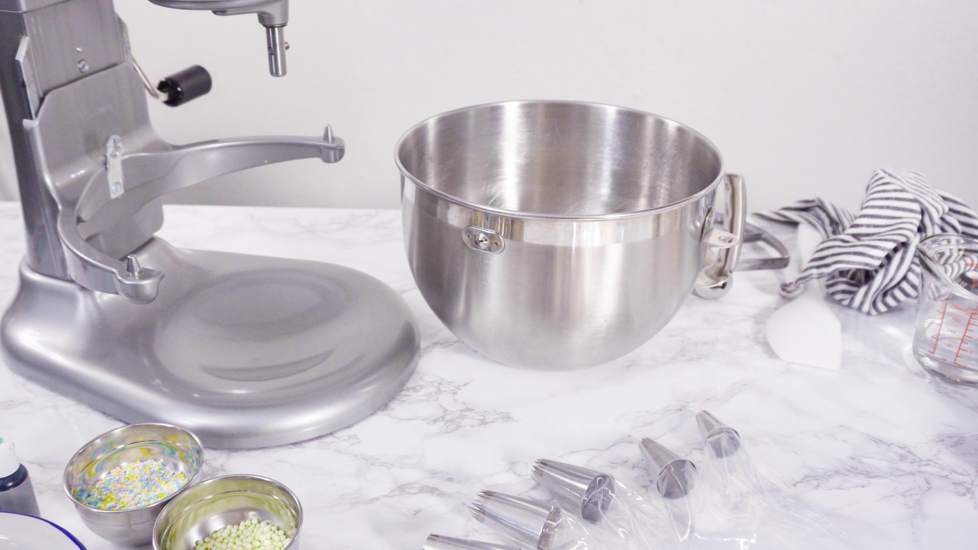 Modular kitchen tools and plated desserts on stainless surface